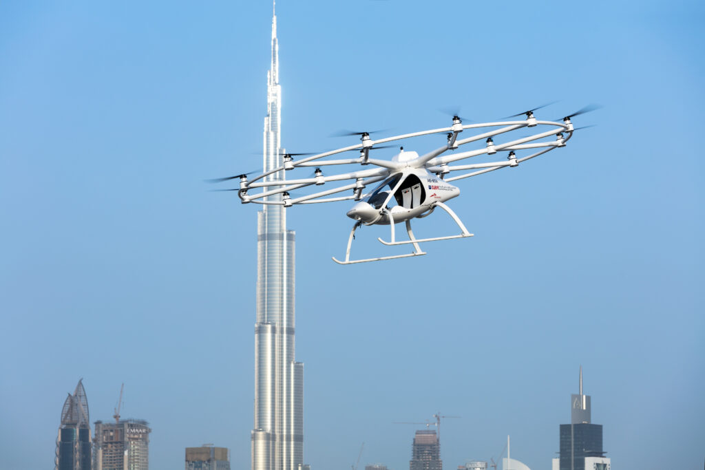 Volocopter eVTOL aircraft flying near the Burj Khalifa during a test flight in Dubai